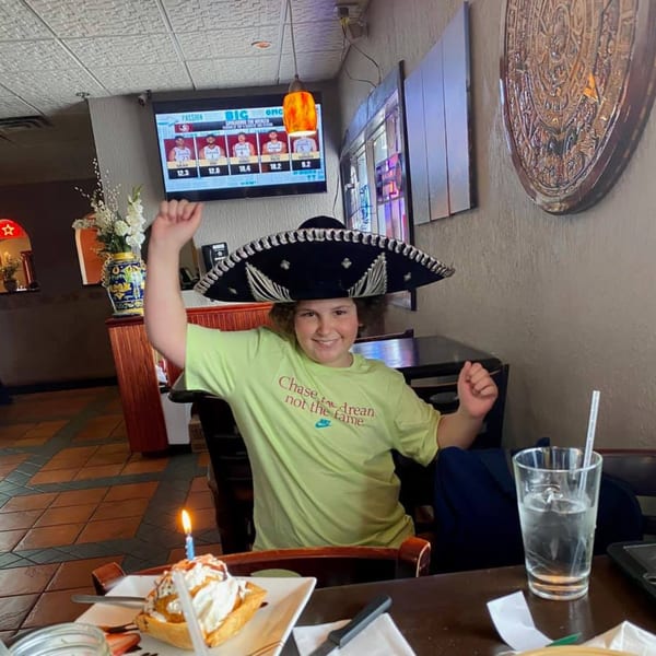 A boy in a sombrero celebrates his birthday with dessert at Mayan Palace, a Mexican restaurant.