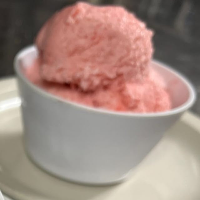 Scoop of Strawberry Cheesecake Gelato.